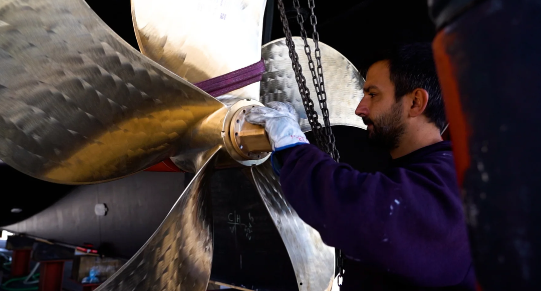 METALNOX technician working on a large marine propeller