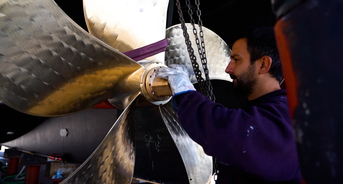 METALNOX technician working on a large marine propeller