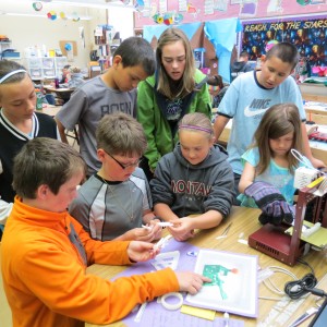 Students get hands-on with a catapult project.