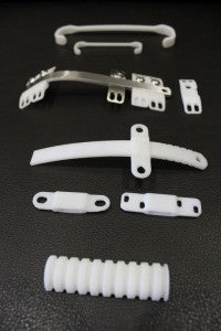 Dr. Yüksel's 3D-printed prototypes with the steel bar.